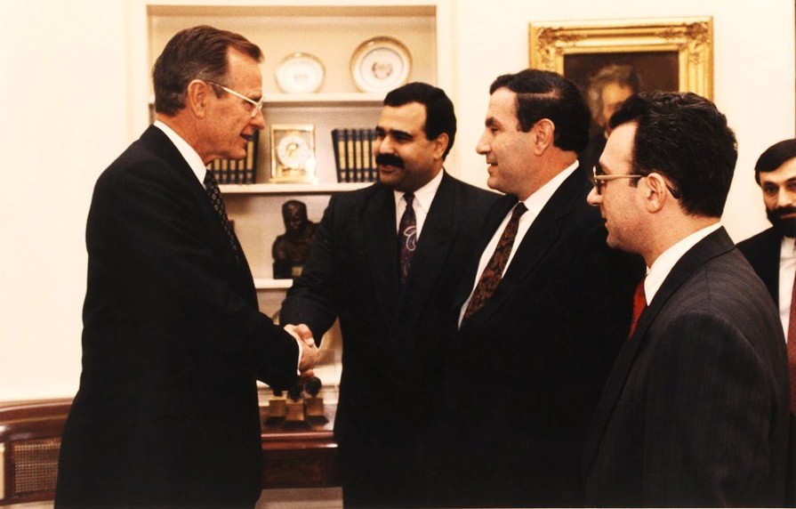 Raffi Hovannisian, then foreign minister of Armenia, shakes hands with U.S. President George W. Bush. (Courtesy of Garin Hovannisian)